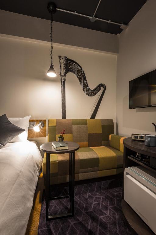 Ліжко або ліжка в номері Hotel Resol Nagoya