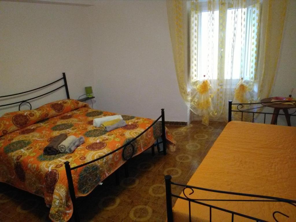 Ένα ή περισσότερα κρεβάτια σε δωμάτιο στο B&B Al Duomo Carrela di Ghjeja