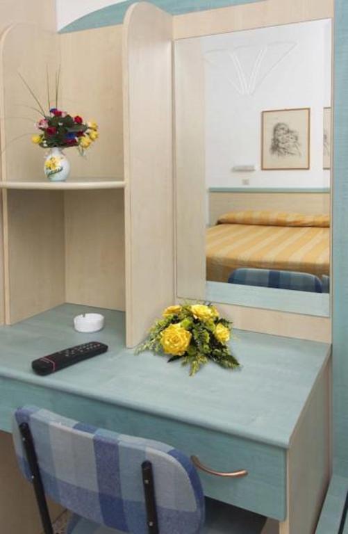 Łóżko lub łóżka w pokoju w obiekcie Hotel Diana