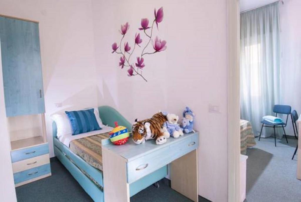 Łóżko lub łóżka w pokoju w obiekcie Hotel Diana
