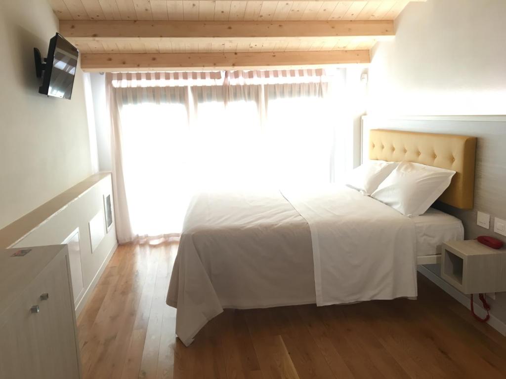 Postel nebo postele na pokoji v ubytování Residenza Ai Capitelli