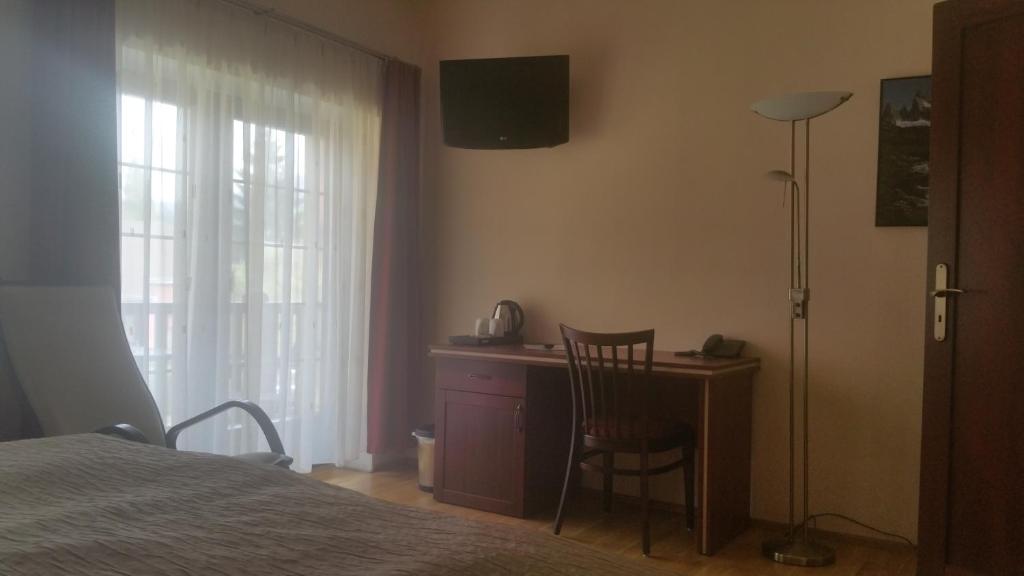 TV a/nebo společenská místnost v ubytování Hotel Výpřež - Děčín