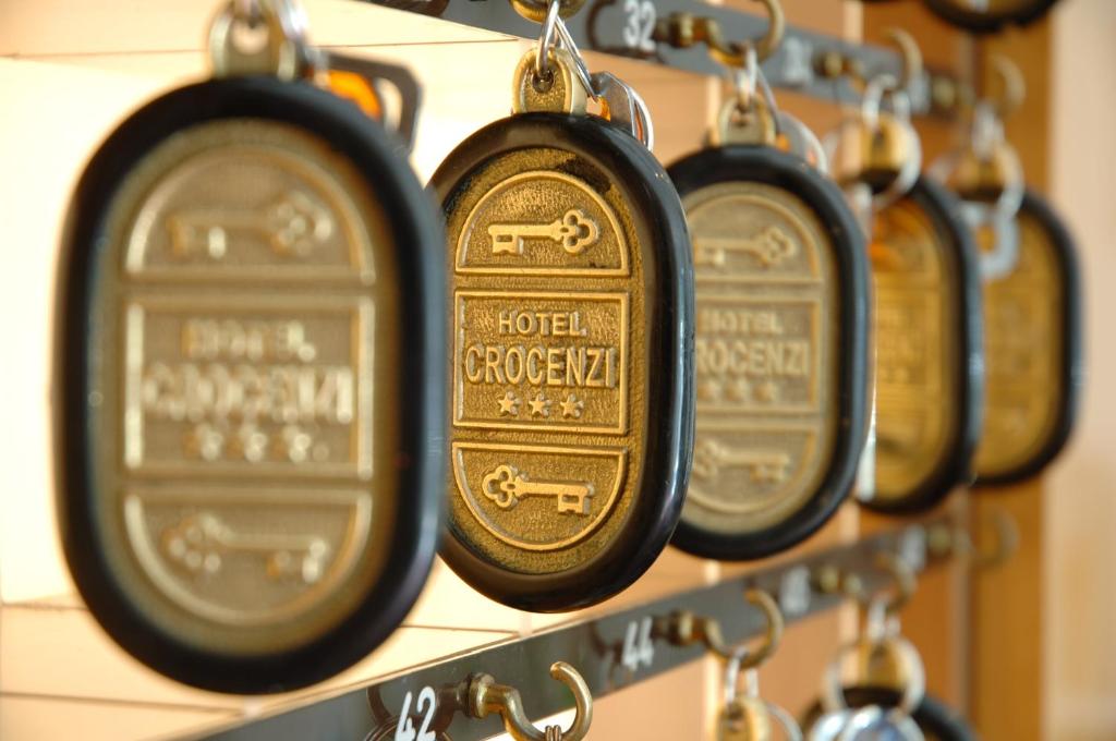 a row of alarm clocks on a shelf at Hotel Crocenzi in San Marino