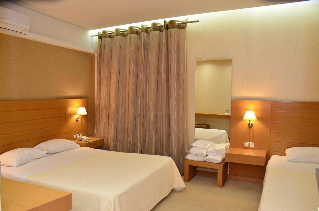 Ένα ή περισσότερα κρεβάτια σε δωμάτιο στο Deves Hotel 