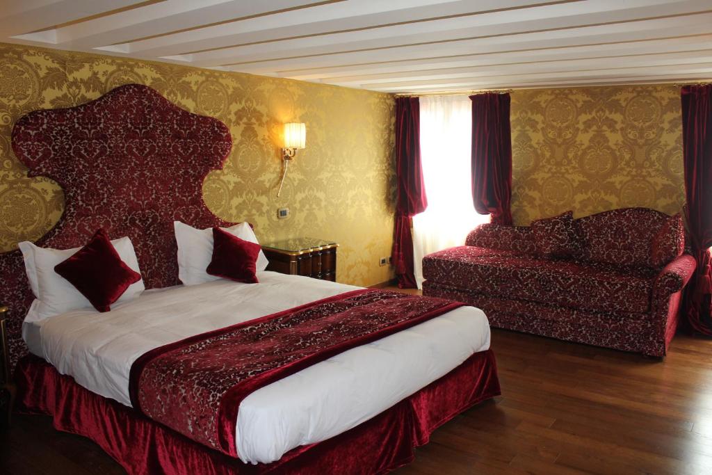 Postel nebo postele na pokoji v ubytování Hotel Casanova