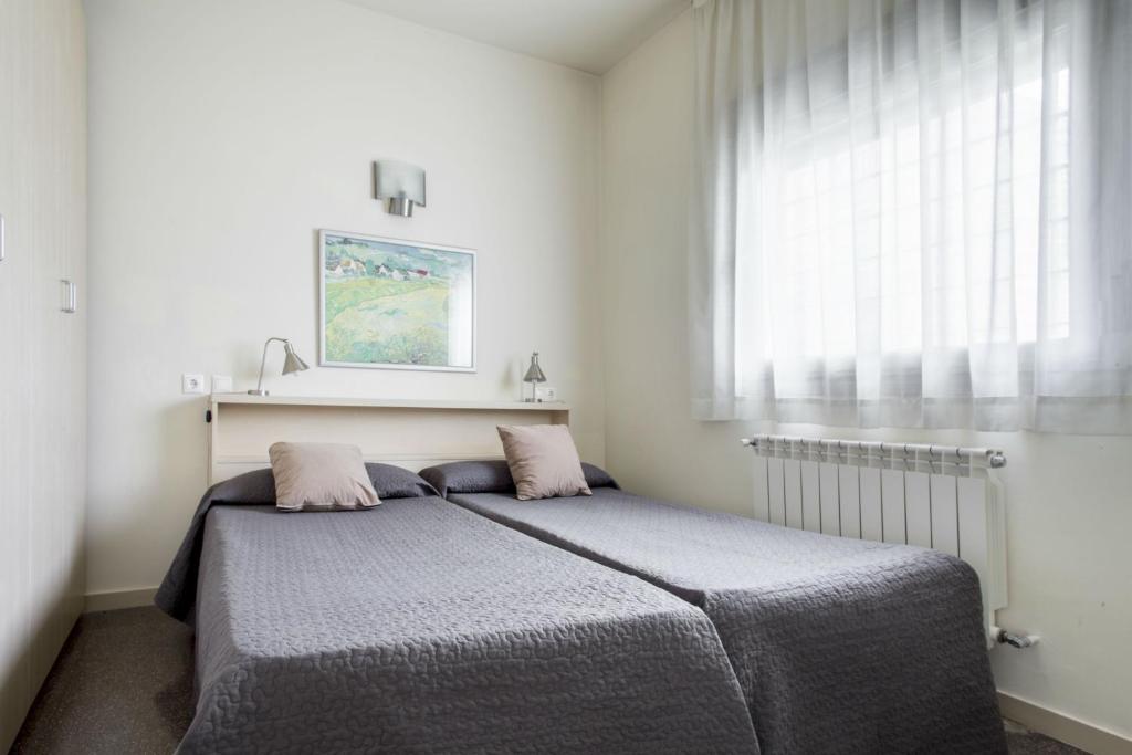 Postel nebo postele na pokoji v ubytování Residencia Universitaria Resa Los Abedules