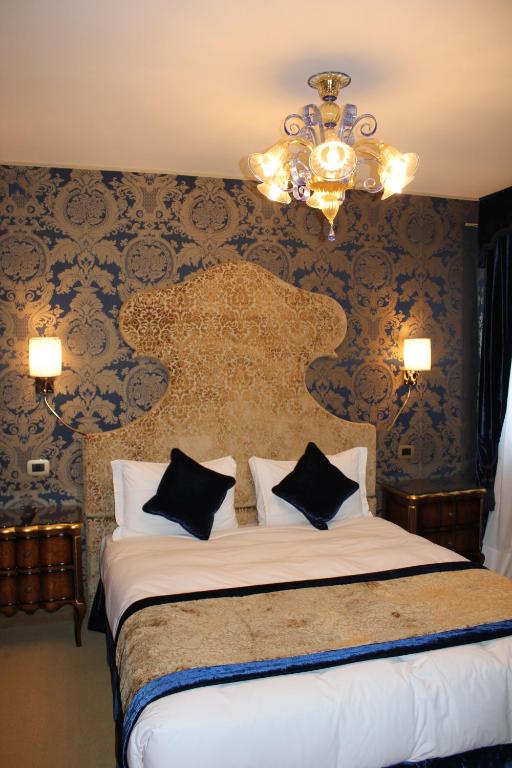 Postel nebo postele na pokoji v ubytování Hotel Casanova