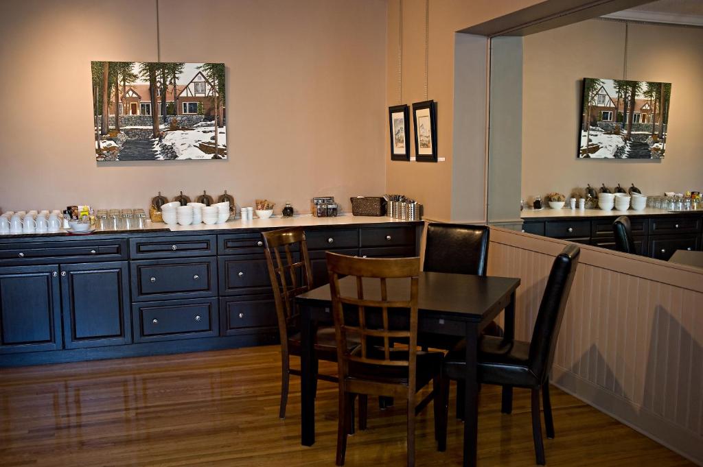 a dining room with a table and chairs at Banff Boutique Inn - Adults only in Banff