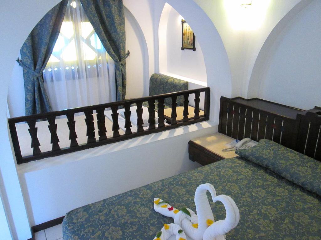 Postel nebo postele na pokoji v ubytování Arabella Azur Resort