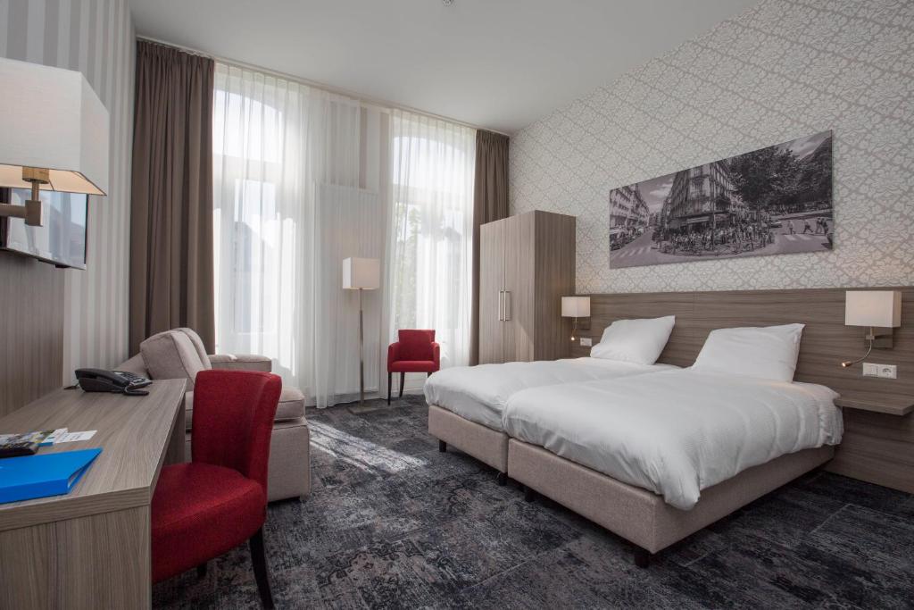 Postel nebo postele na pokoji v ubytování Fletcher Hotel-Restaurant Middelburg