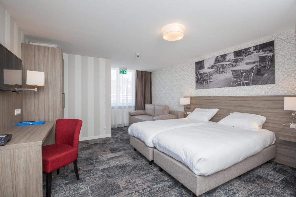 Postel nebo postele na pokoji v ubytování Fletcher Hotel-Restaurant Middelburg