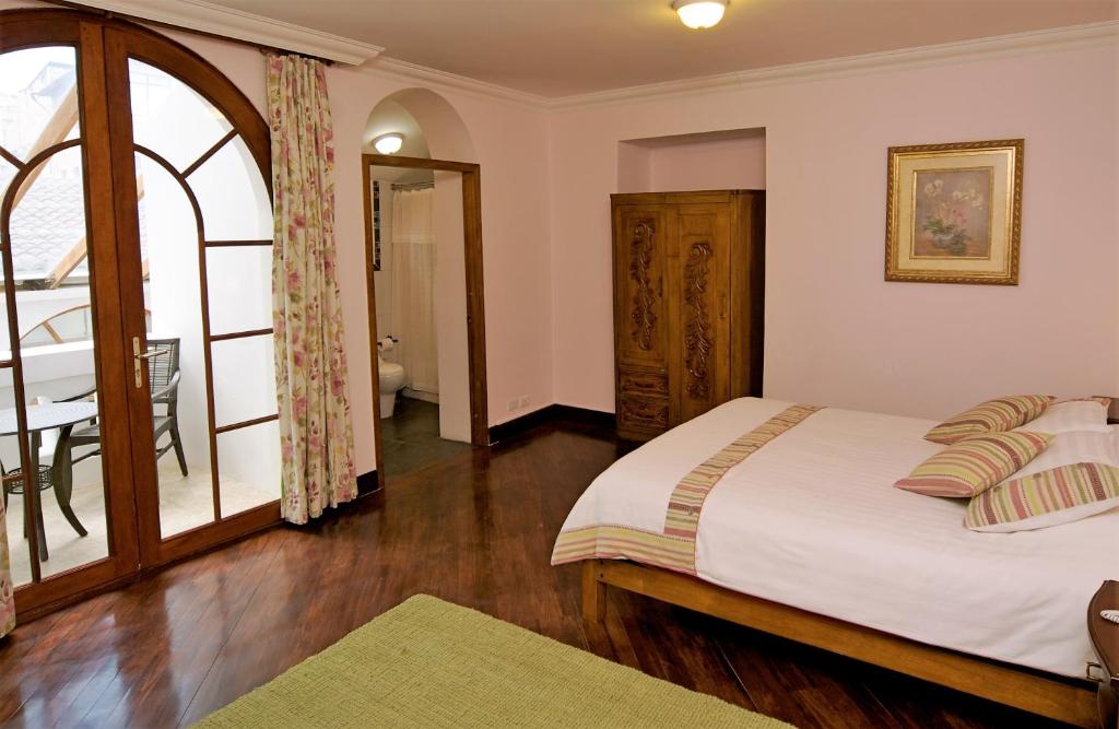 Postel nebo postele na pokoji v ubytování Boutique Hotel Casa Foch