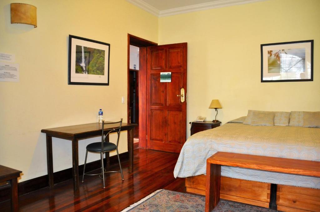 Postel nebo postele na pokoji v ubytování Boutique Hotel Casa Foch