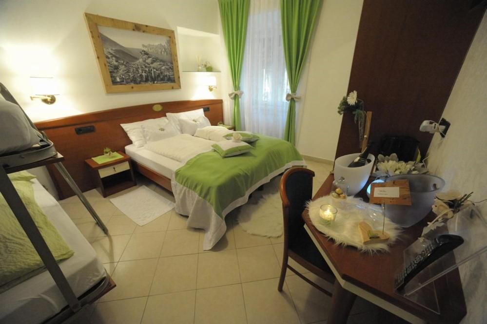 Postel nebo postele na pokoji v ubytování B&Bio Garda Ulivi