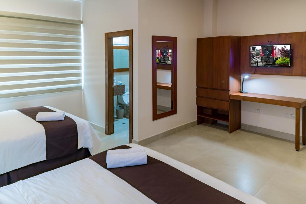 TV a/nebo společenská místnost v ubytování Hotel La Ría Durán