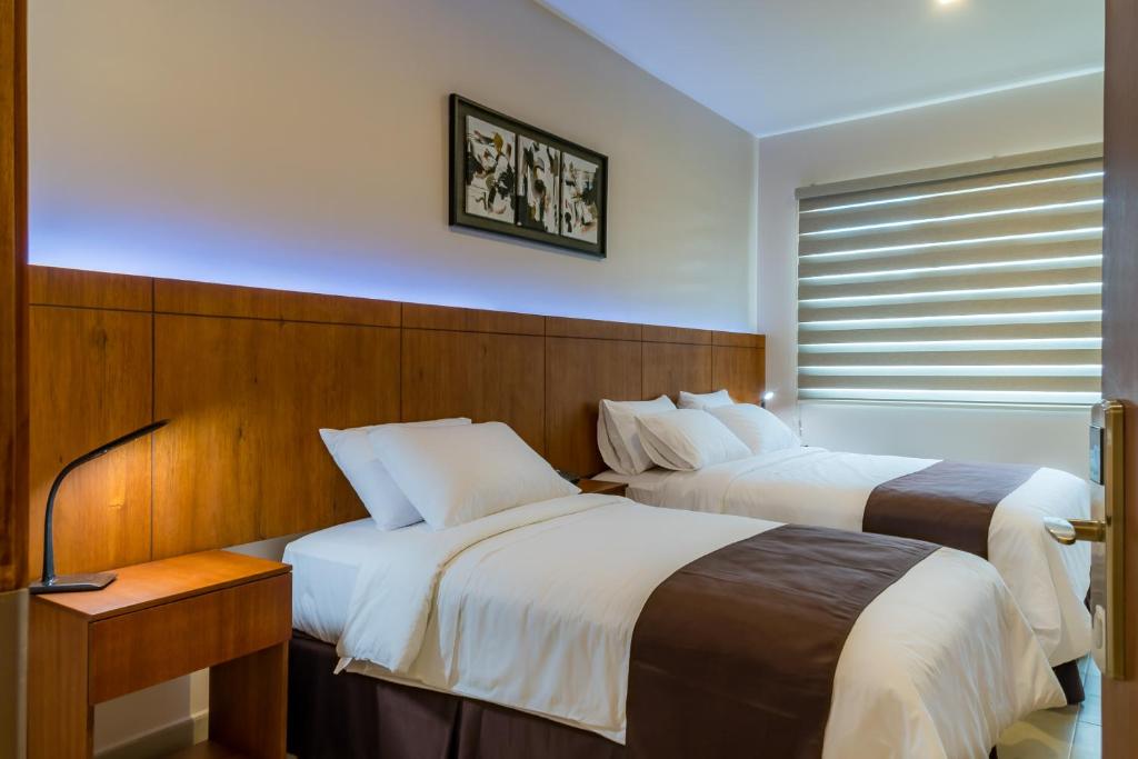 Postel nebo postele na pokoji v ubytování Hotel La Ría Durán