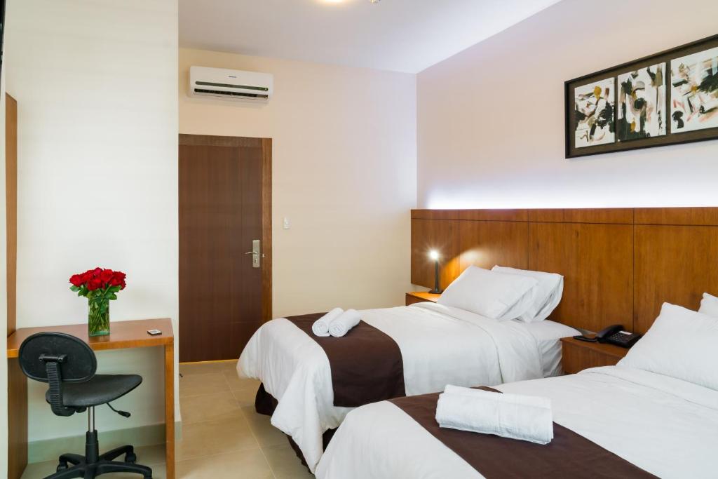 Postel nebo postele na pokoji v ubytování Hotel La Ría Durán