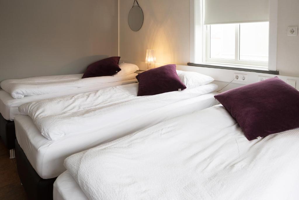 Postel nebo postele na pokoji v ubytování Casablanca Apartments