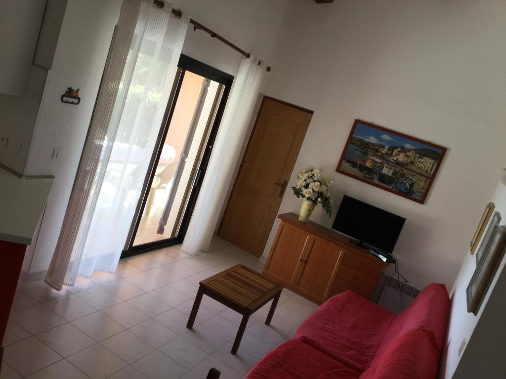 TV a/nebo společenská místnost v ubytování Résidence Playa Del'Oro