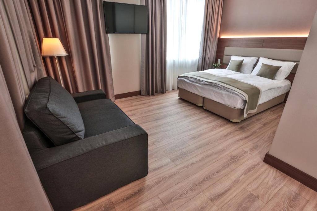 Postel nebo postele na pokoji v ubytování Ocak Aparthotel