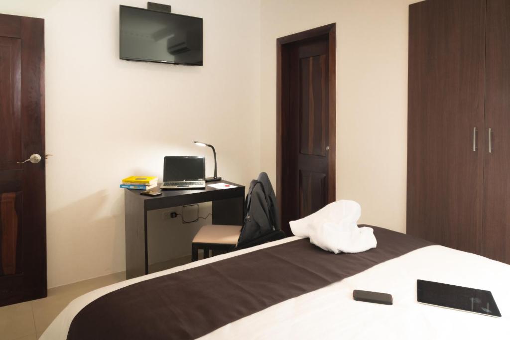 TV a/nebo společenská místnost v ubytování Hotel La Ría Playas