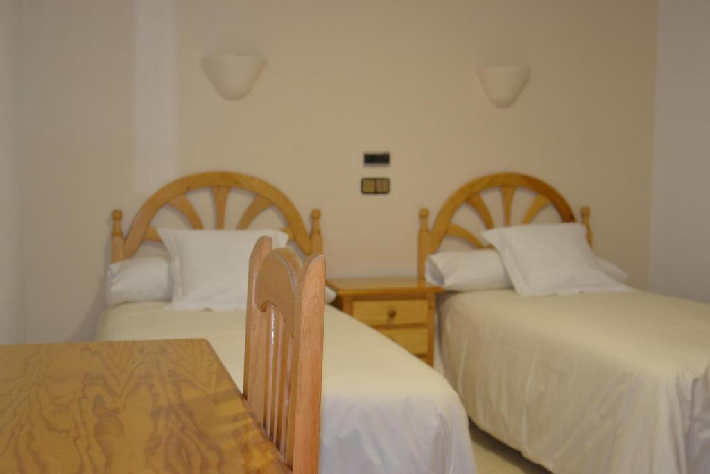 Postel nebo postele na pokoji v ubytování Hotel Balcón de Cazorla
