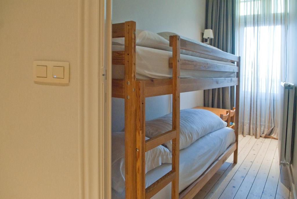 Postel nebo postele na pokoji v ubytování Grand Hotel Belle Vue