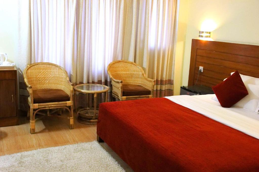 Ein Bett oder Betten in einem Zimmer der Unterkunft Hotel Tara
