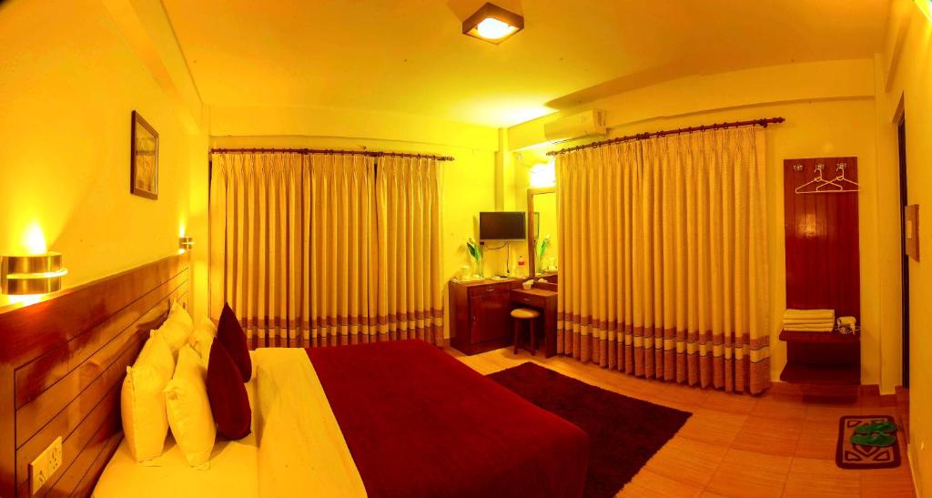 Ein Bett oder Betten in einem Zimmer der Unterkunft Hotel Tara