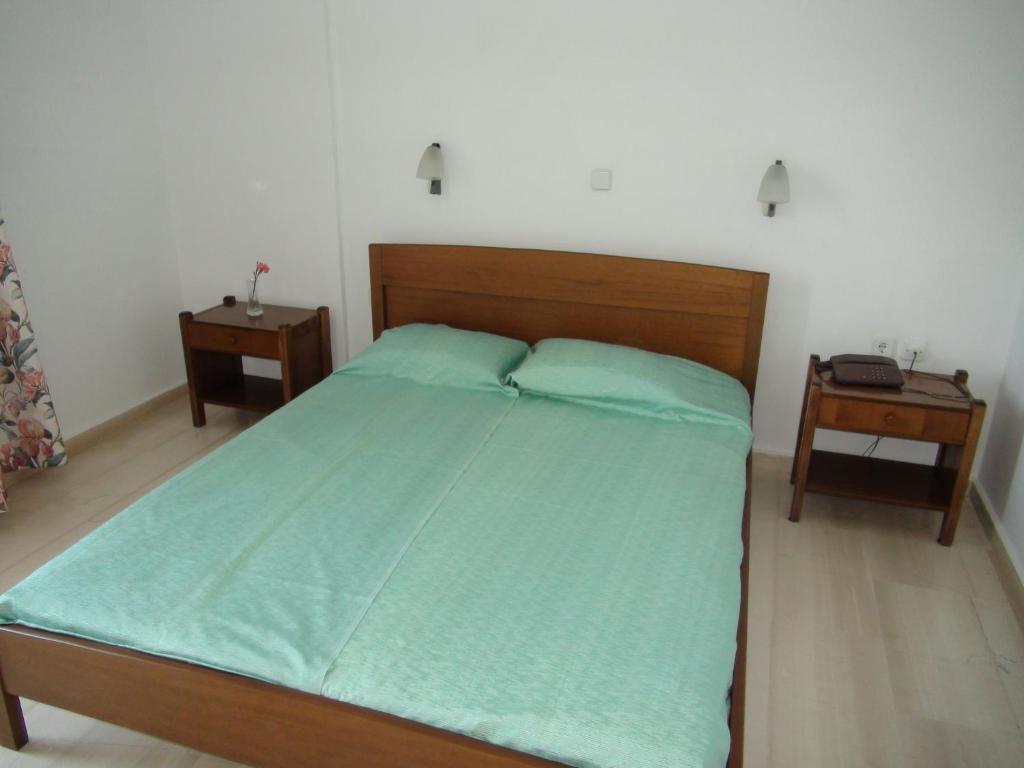 A bed or beds in a room at Filoxenia Hotel & Apartments