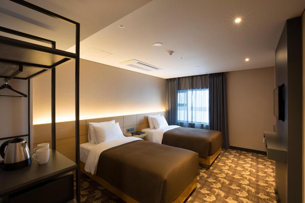 Postel nebo postele na pokoji v ubytování Hotel Foret Premier Nampo