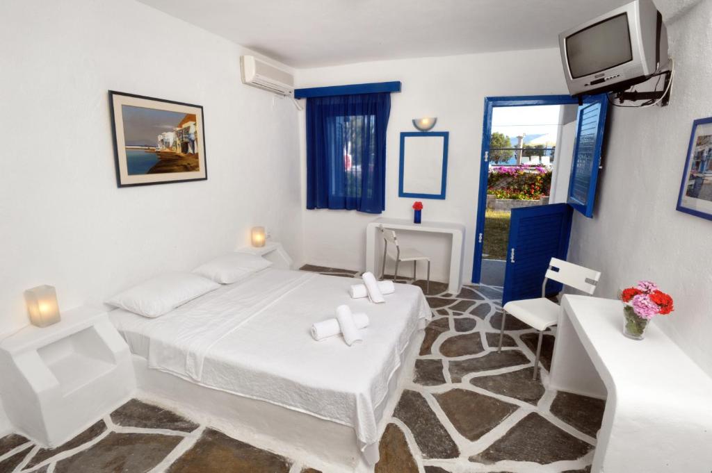 Postel nebo postele na pokoji v ubytování Lagada Beach Hotel