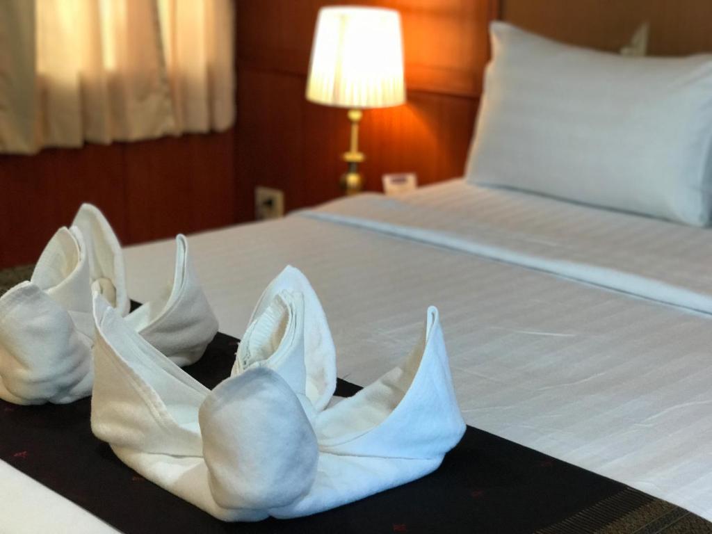 Postel nebo postele na pokoji v ubytování Orchid Resort