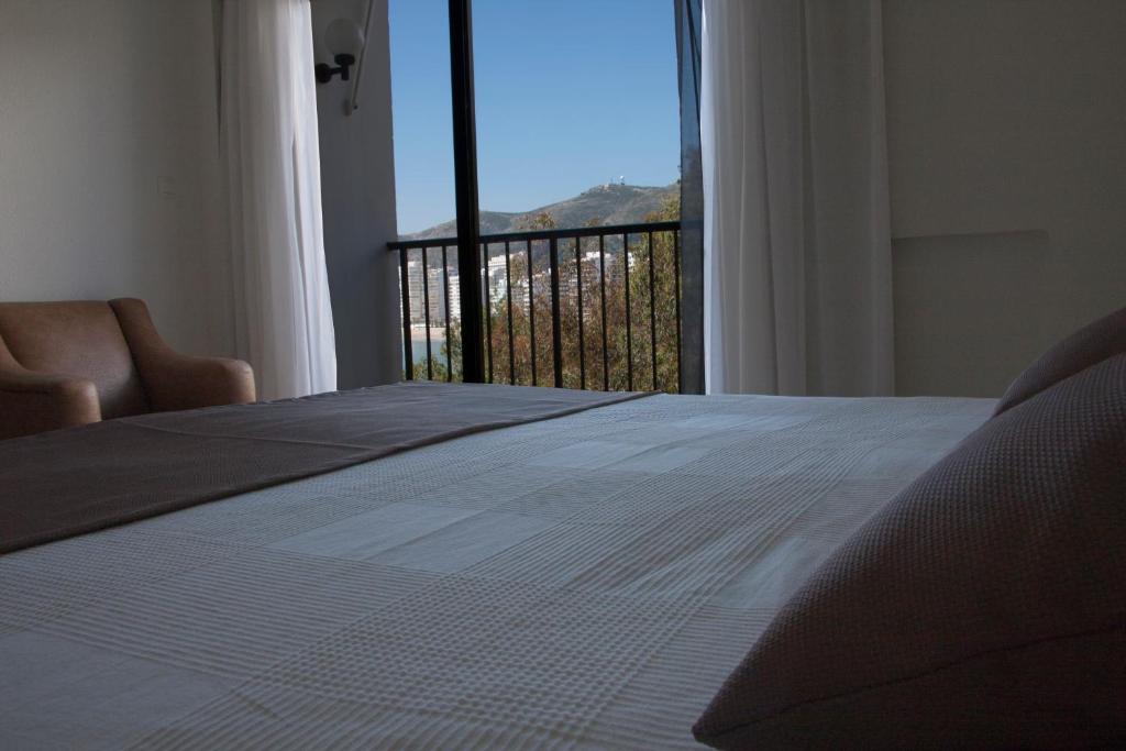 Postel nebo postele na pokoji v ubytování Hotel Sicania