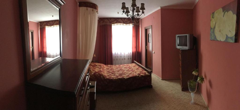 Postel nebo postele na pokoji v ubytování Hotel Premyer