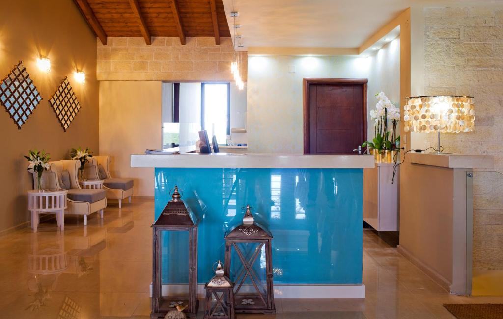 a large aquarium in the middle of a room at Ornella Beach Resort & Villas in Syvota