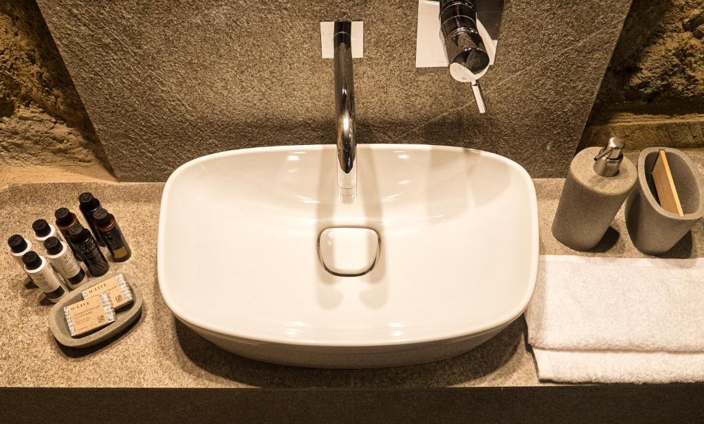 a white sink with a faucet in a bathroom at Trinity Boutique Hotel in Rhodes Town