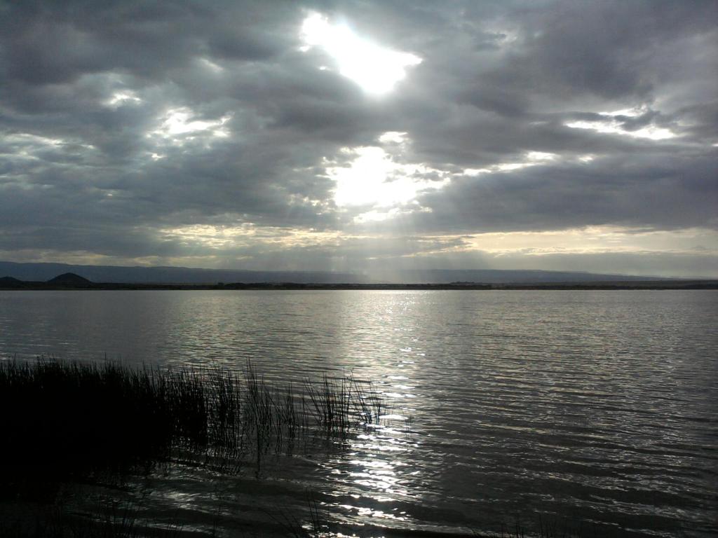 a large body of water with a cloudy sky at Cactus Eco Camp and Lodge in Elmenteita