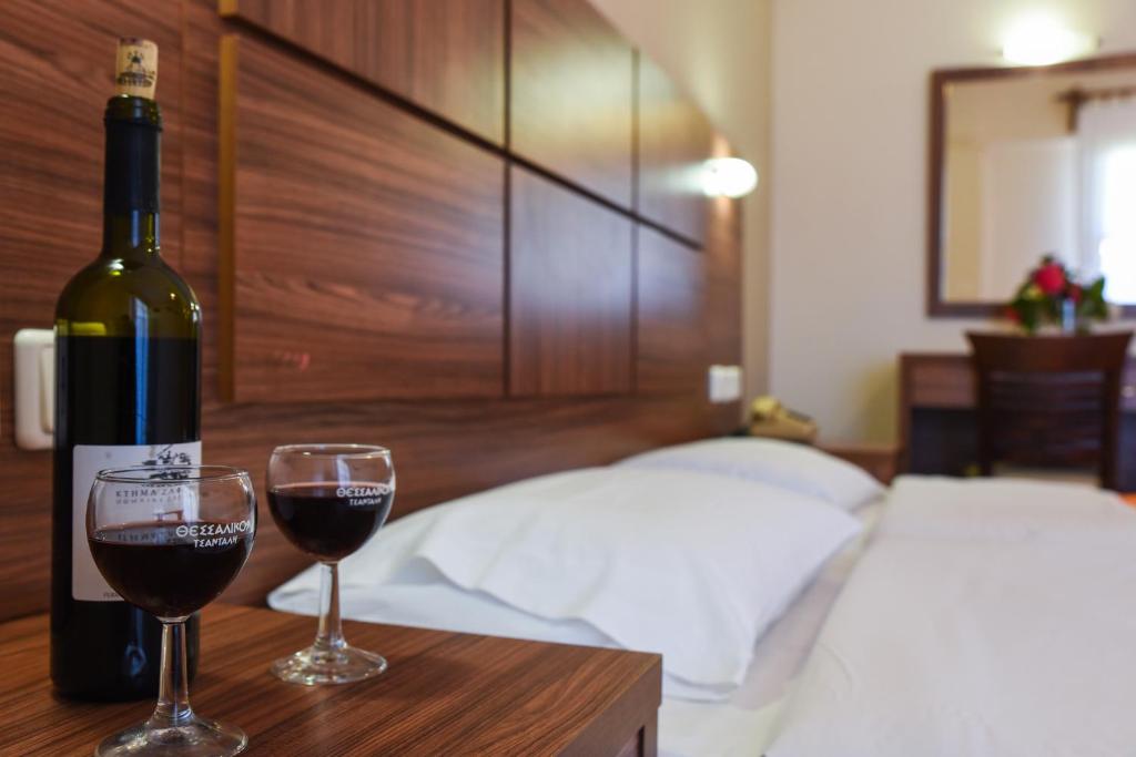 Łóżko lub łóżka w pokoju w obiekcie Hotel Eleana
