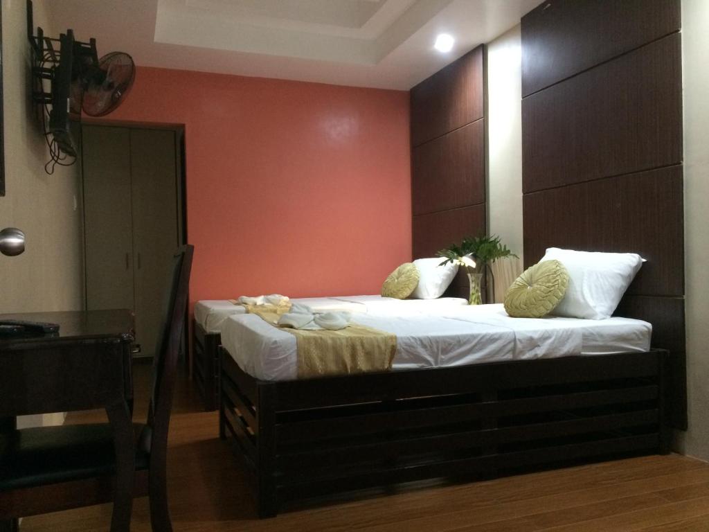 Postel nebo postele na pokoji v ubytování Mañana Hotel