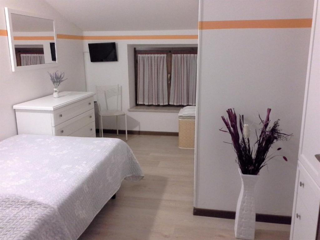 Postel nebo postele na pokoji v ubytování Hotel La Rama