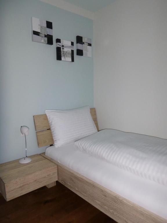 Postel nebo postele na pokoji v ubytování Hotel Metzgern