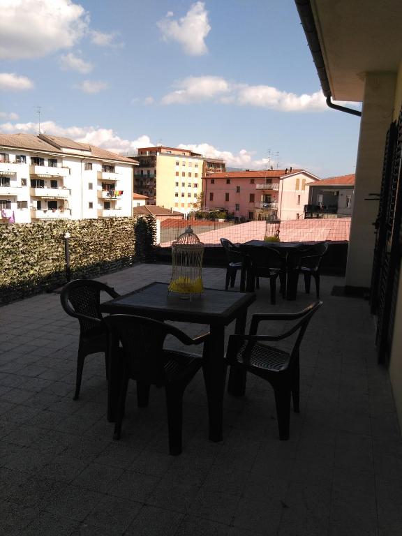 a group of tables and chairs on a patio at La Corte dei Morra in Venafro