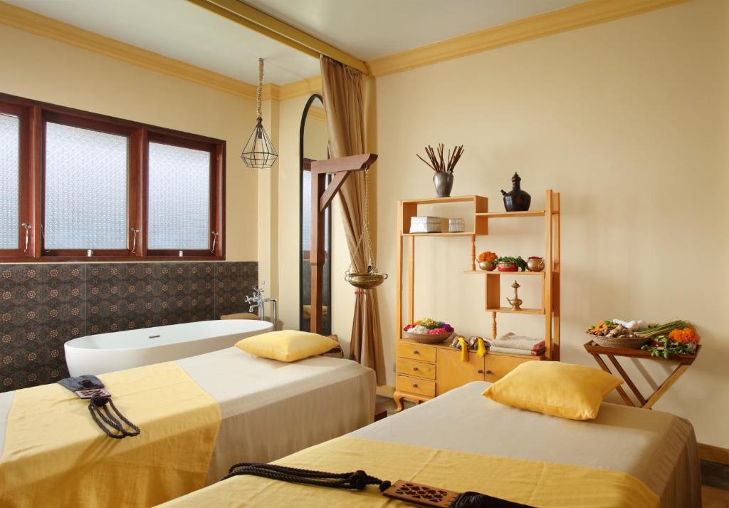 Postel nebo postele na pokoji v ubytování Adiwana Resort Jembawan
