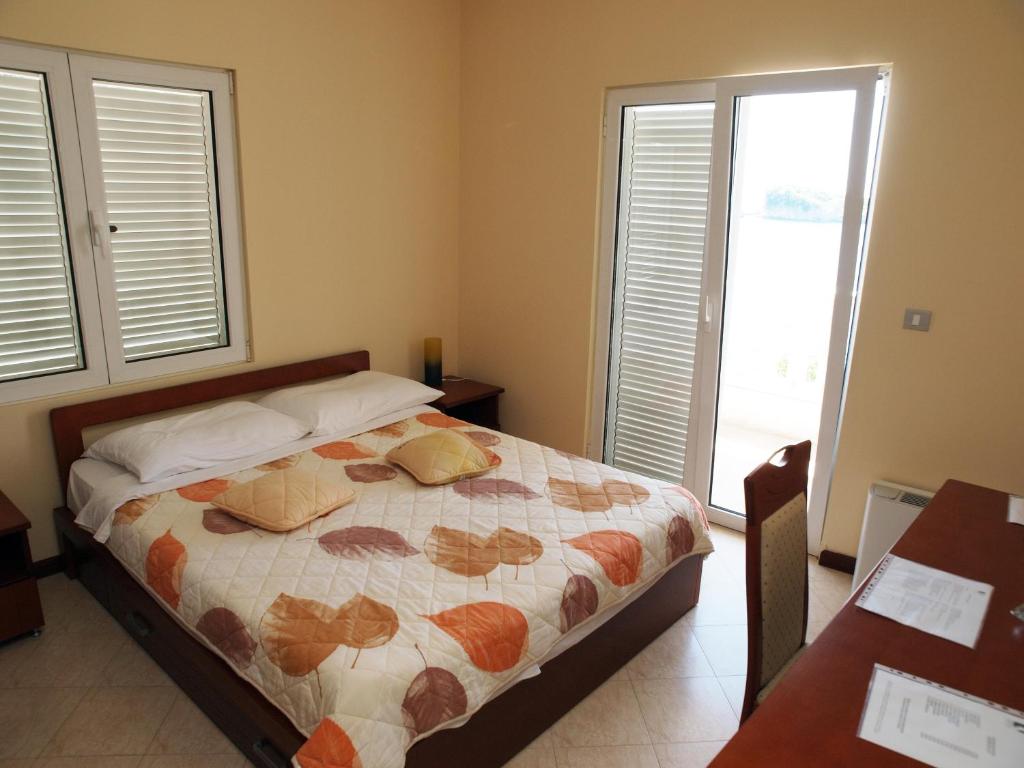 Postel nebo postele na pokoji v ubytování Hotel R