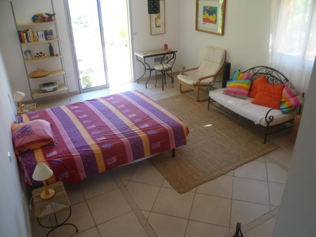 Кровать или кровати в номере Villa du Bau Rouge