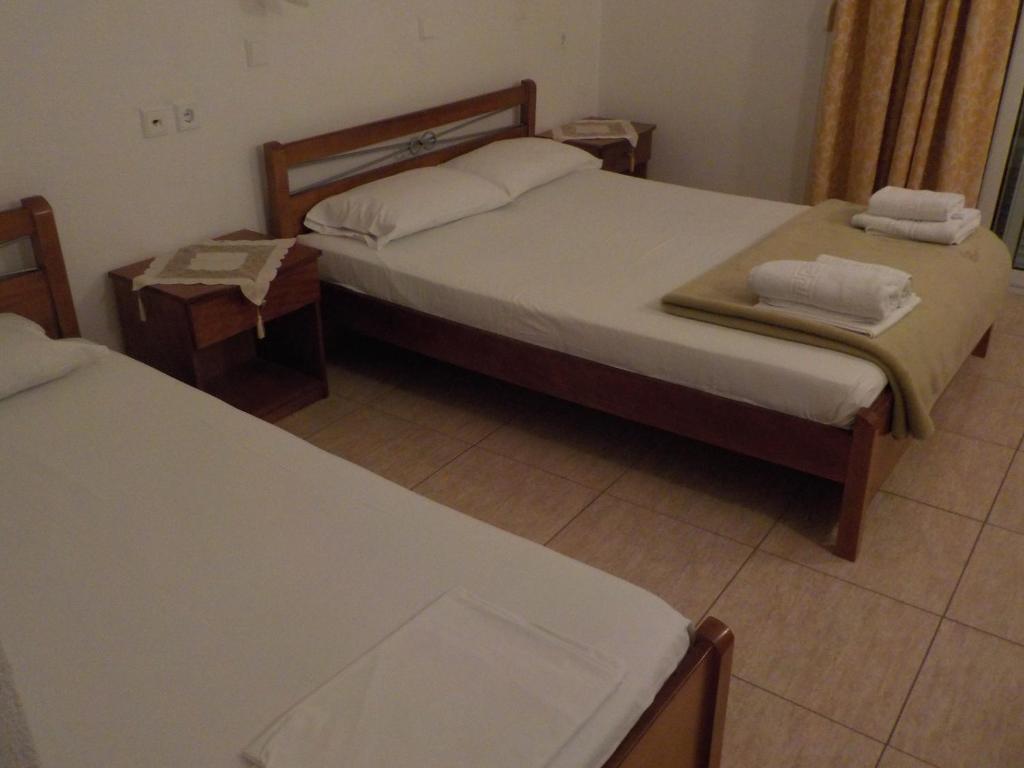 Postel nebo postele na pokoji v ubytování Estelle Hotel