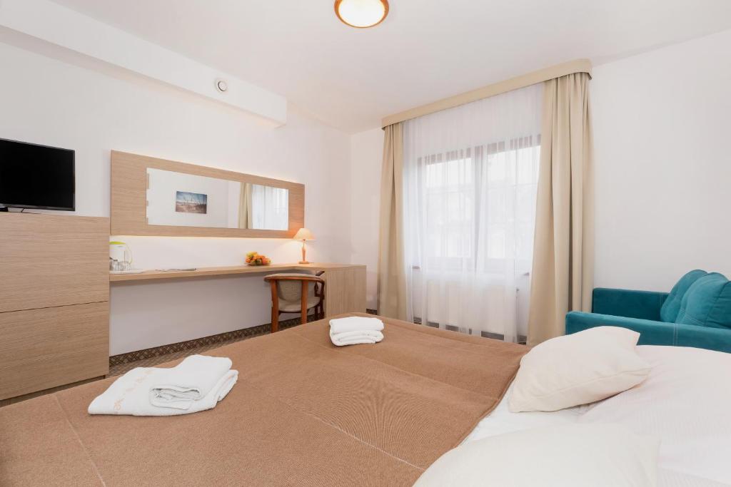 Ein Bett oder Betten in einem Zimmer der Unterkunft Willa Arielka