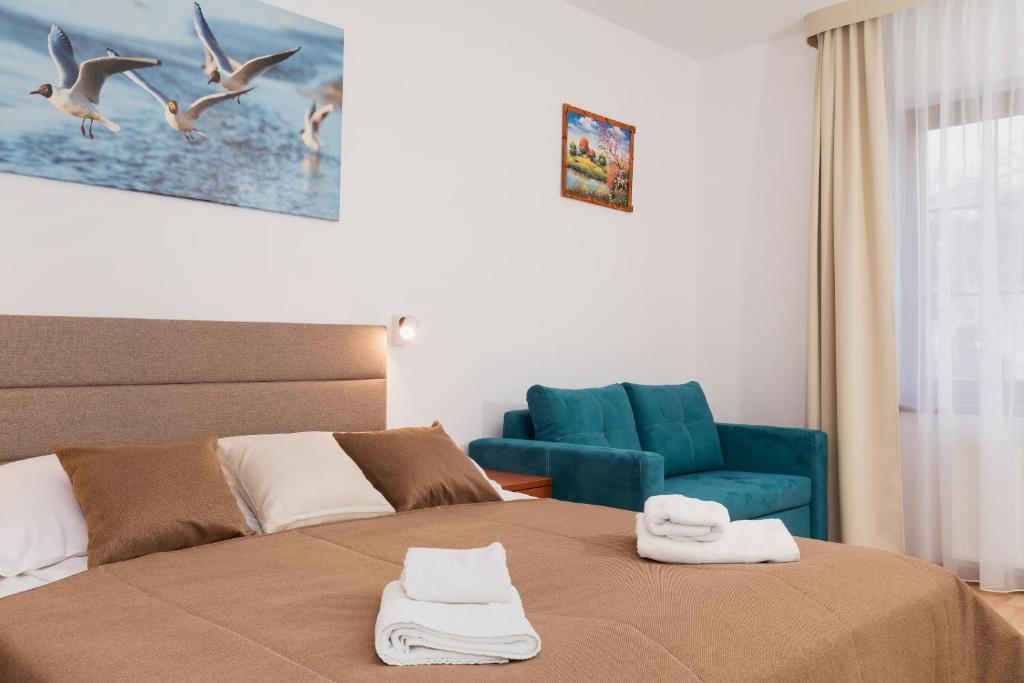 Ein Bett oder Betten in einem Zimmer der Unterkunft Willa Arielka