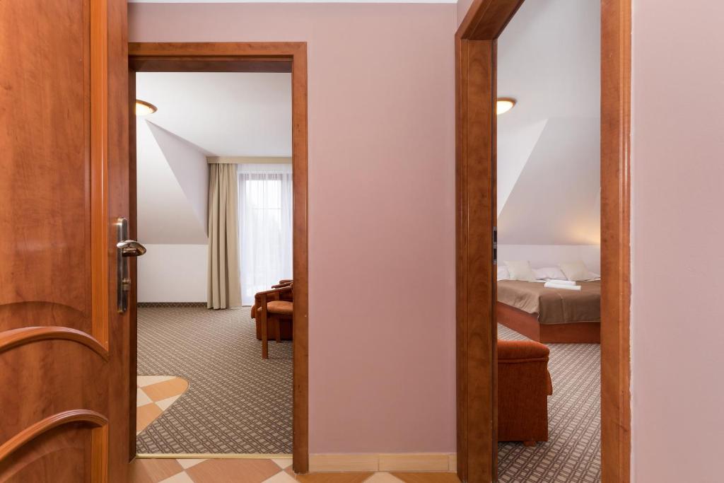 Ein Bett oder Betten in einem Zimmer der Unterkunft Willa Arielka